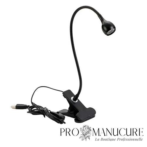 Mini lampe LED noire ProManucure avec pince et col de cygne flexible pour pose de capsules américaines.